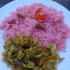 A picture of Pink rice with herbs and cabbage.