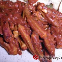 A picture of Okra with tomatoes in the oven.