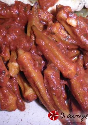 A picture of Okra with tomatoes in the oven.