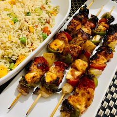 Chicken shashlik with cottage cheese serve with fried rice A picture of Chicken shashlik with cottage cheese serve with fried rice.