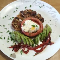 A picture of Sausage, Cauliflower Steak with Poached egg and Avo.