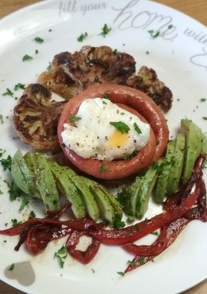 A picture of Sausage, Cauliflower Steak with Poached egg and Avo.