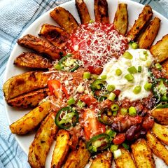 A picture of Spicy Taco Bean Bowl With Peri Peri Wedges (Vegetarian).