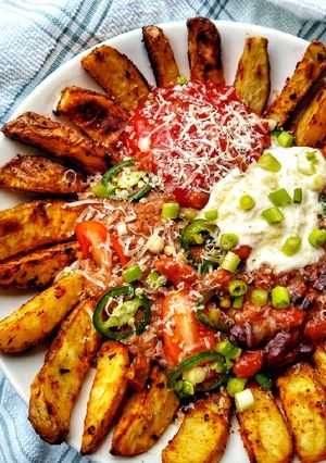 A picture of Spicy Taco Bean Bowl With Peri Peri Wedges (Vegetarian).