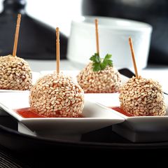 Chicken lollipops with tomato sauce A picture of Chicken lollipops with tomato sauce.