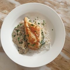 A picture of Stuffed chicken with mushroom sauce.