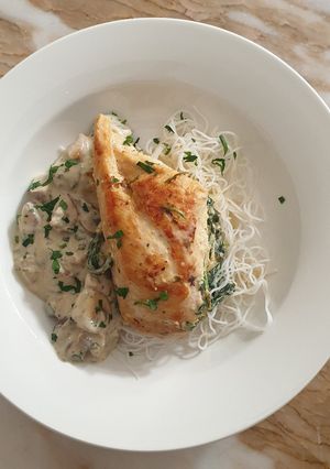A picture of Stuffed chicken with mushroom sauce.