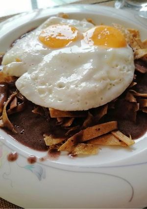 A picture of Chilaquiles with Bean Sauce.