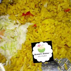 Curry jollof rice with coslow A picture of Curry jollof rice with coslow.