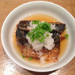 A picture of Grilled mackerel and grated mooli in Japanese style.