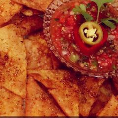 A picture of Fresh Tomato salsa with Nachos.