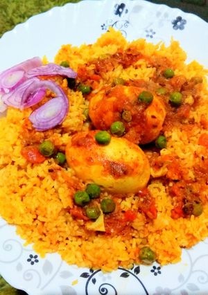 A picture of Egg curry with green pea.