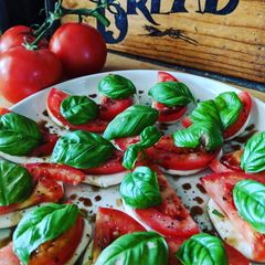 A picture of Fresh tomato, basil and mozzarella.