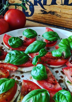 A picture of Fresh tomato, basil and mozzarella.