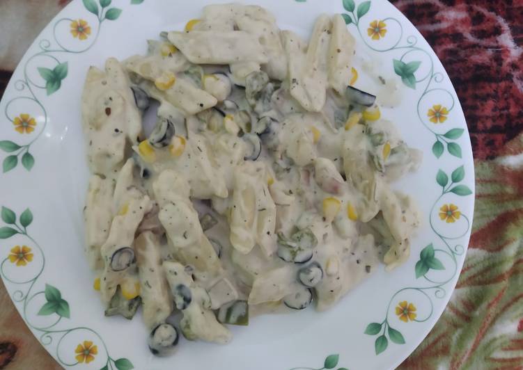 White pasta with black olive