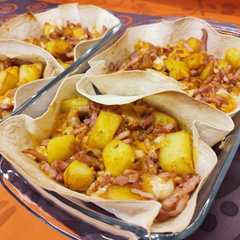 Una foto de Patatas cheddar con bacon al mojo picón