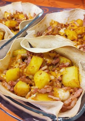 Una foto de Patatas cheddar con bacon al mojo picón