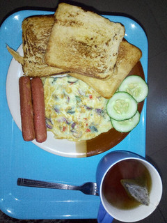 A picture of Cripsy toast, eggs and sausage.