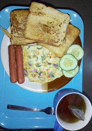 A picture of Cripsy toast, eggs and sausage.