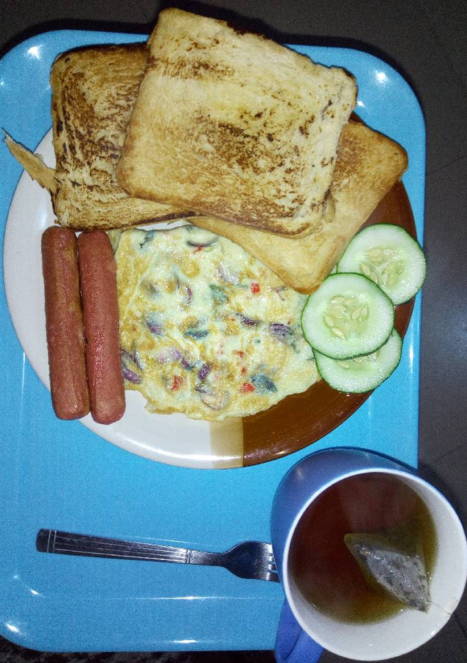 A picture of Cripsy toast, eggs and sausage.