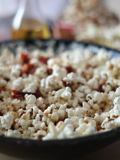 A picture of Popcorn with crispy bacon, paprika and honey.