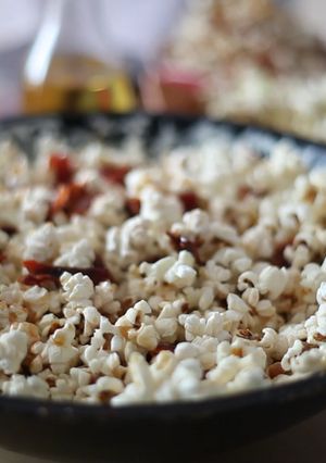 A picture of Popcorn with crispy bacon, paprika and honey.