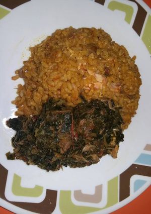 A picture of Ofada Jollof and smoked fish Veg.