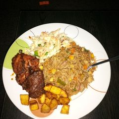 A picture of Chinese rice and marinated chicken.