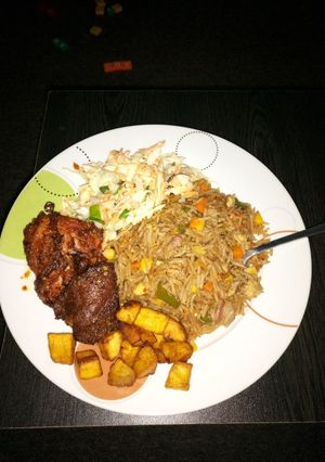 A picture of Chinese rice and marinated chicken.