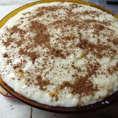 Una foto de Arroz con leche, canela y naranja