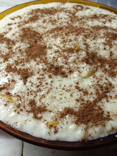 Una foto de Arroz con leche, canela y naranja