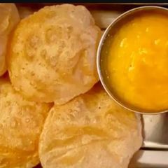 A picture of Aam ras with puri.