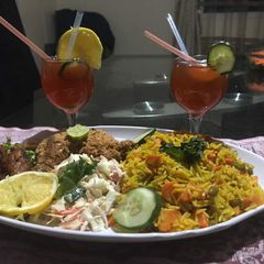 A picture of Basmatic Jollof rice with KFC & salad.