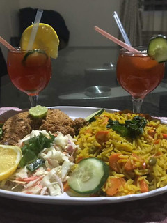 A picture of Basmatic Jollof rice with KFC & salad.