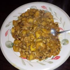 A picture of Porriage beans with unripe plantain.
