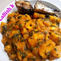 A picture of Yam Pottage with Ugu leaves.