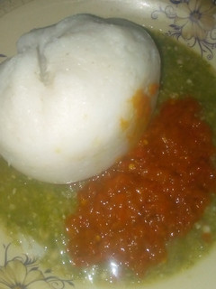 A picture of Tuwon shinkafa with stew and dry okro.