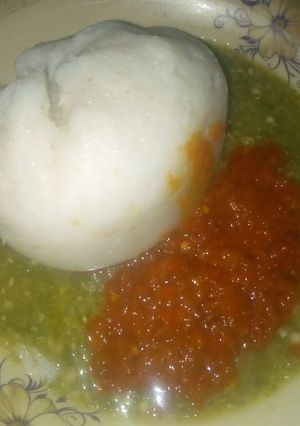 A picture of Tuwon shinkafa with stew and dry okro.