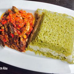 A picture of Green, white rice and Tiger prawns sauce.