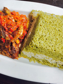 A picture of Green, white rice and Tiger prawns sauce.