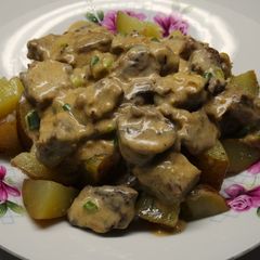 A picture of Beef Stroganoff over Sautéed Potatoes.