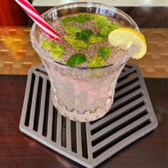 A picture of Lemonade with chai seeds.