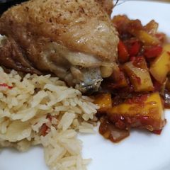 A picture of Sweet and sour mango chicken and pilau rice.