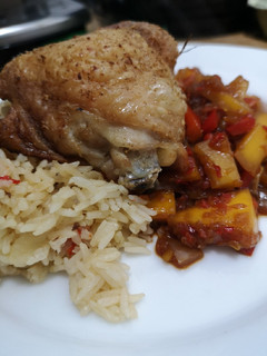 A picture of Sweet and sour mango chicken and pilau rice.