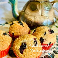A picture of Muffins with wild berries (blueberries and strawberries).