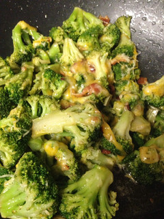 A picture of Bacon and cheese stir fried broccoli.