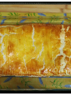 Una foto de Hojaldre con jamón, queso y bechamel