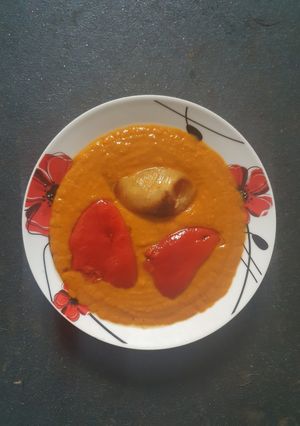 A picture of Soup of Peppers with baked Onions.