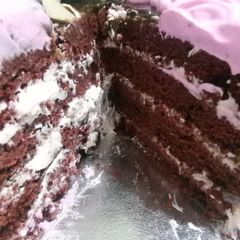 A picture of Moist Chocolate cake with vanilla infused whipped cream.