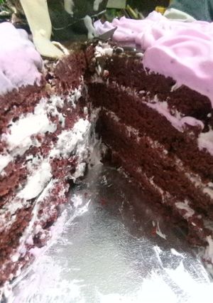 A picture of Moist Chocolate cake with vanilla infused whipped cream.